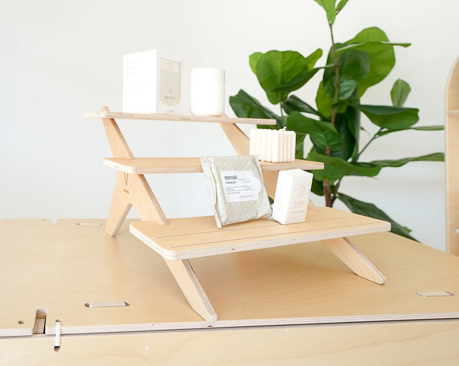 Eco-Friendly Flat Pack Display in Boutique: The shelving unit, emphasizing its sustainable design, displaying boutique fashion accessories in an eco-conscious retail environment.